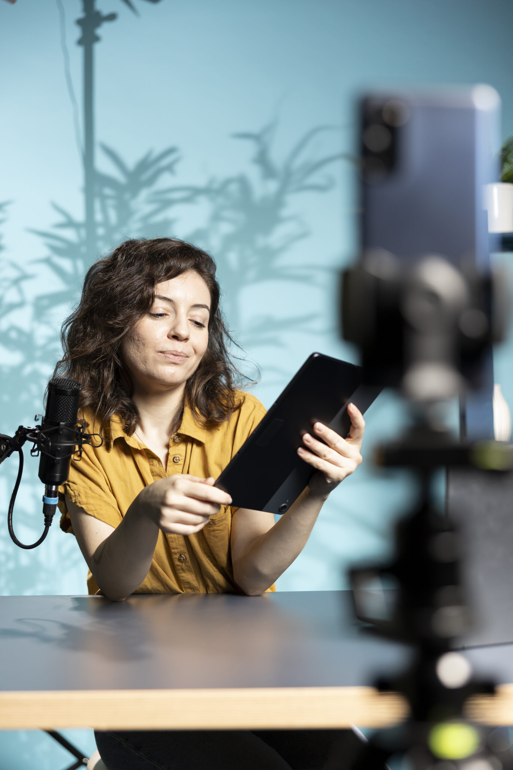 content creator analyzing newly released gaming tablet received from sponsor